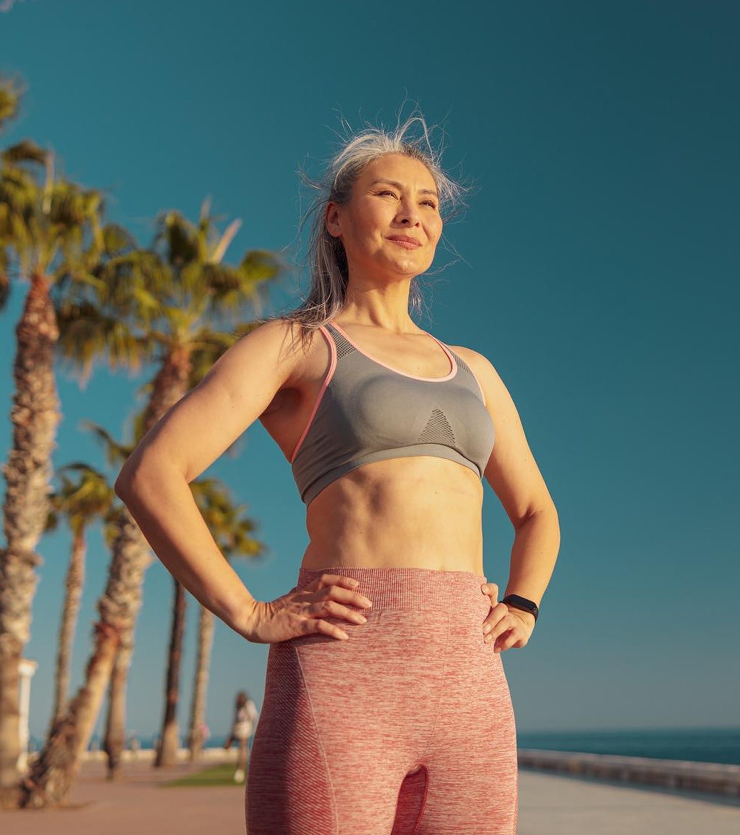 A woman standing on the beach